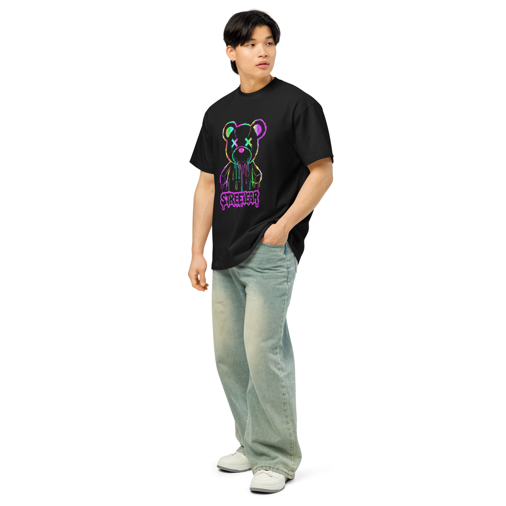 Person wearing a black t-shirt with a colorful bear graphic and 'Supreme' branding